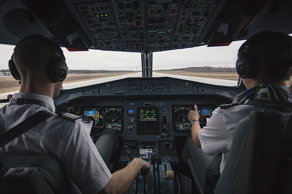 Image depicting plane cockpit during a takeoff