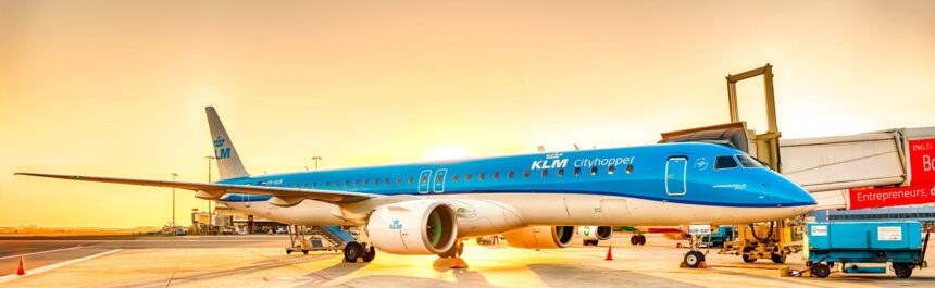 Photogtaphd depicting a KLM Cityhopper Embraer aircraft on the airport runway to mark 60 years of KLM Cityhopper network.