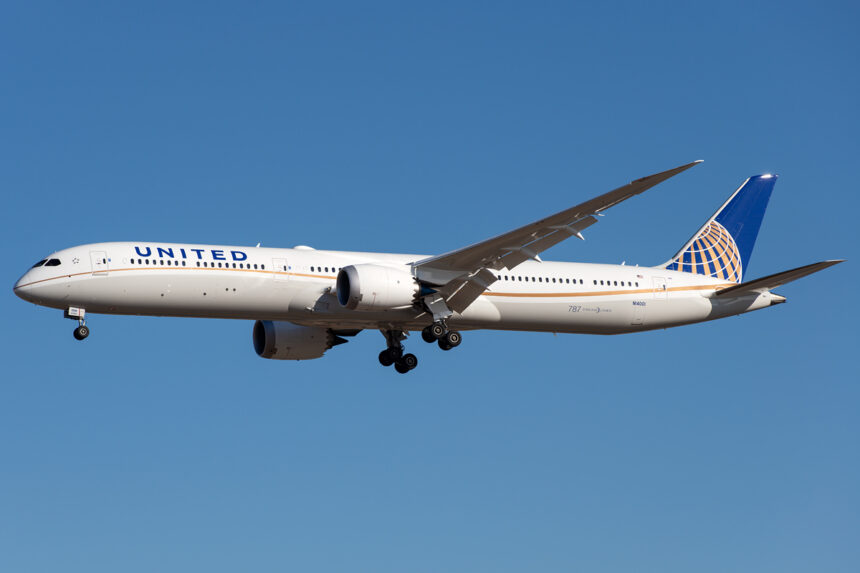 United's Boeing 787 flying with a blue sky backdrop