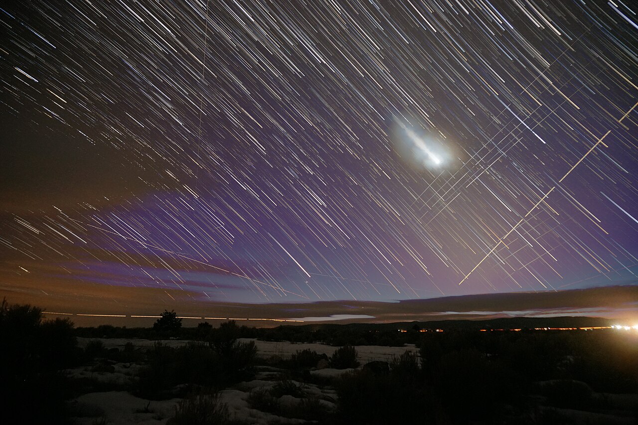 Venus and a line of Starlink satellites visible in the early morning sky