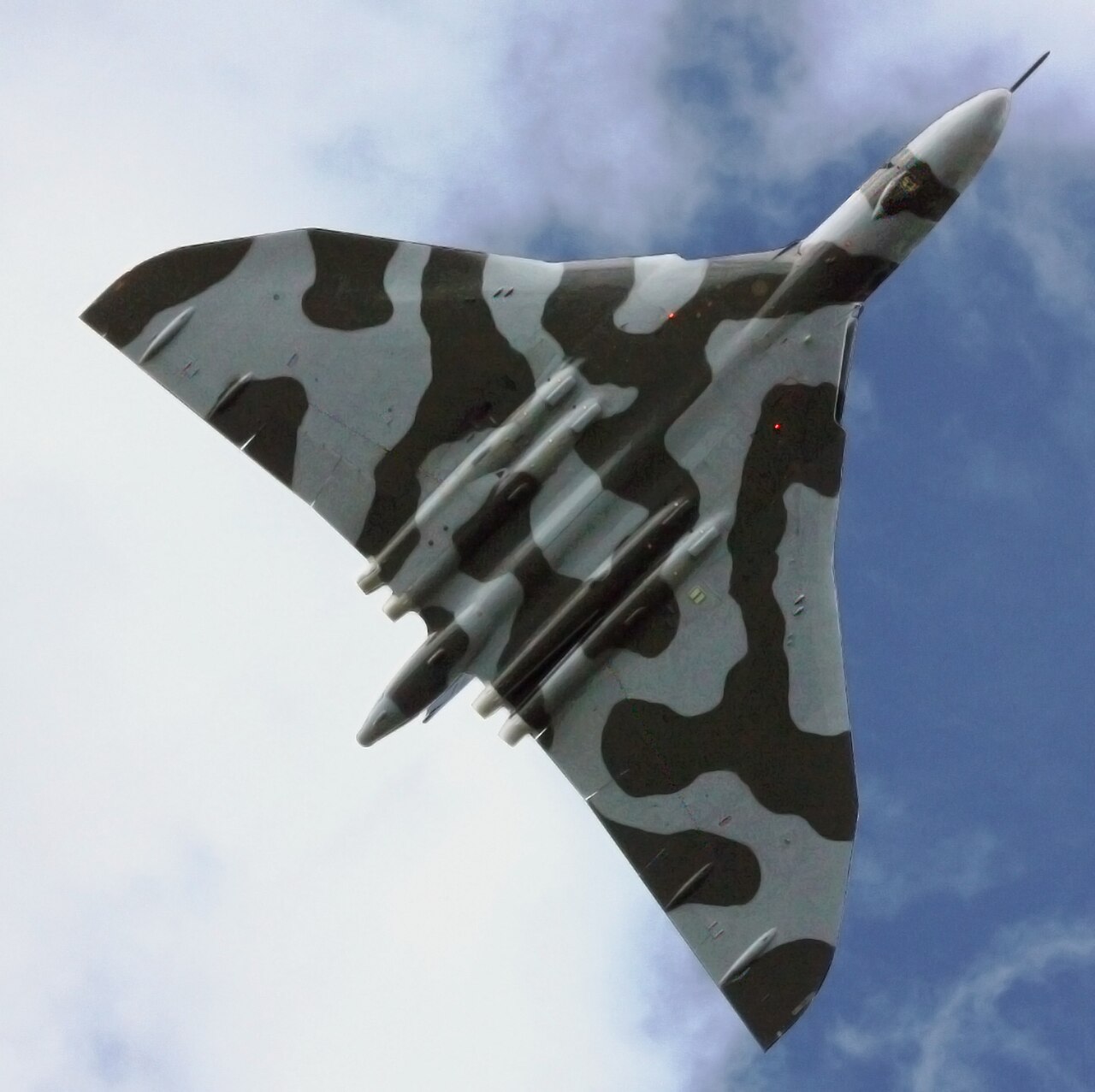 Avro Vulcan XH558 flying overhead against a blue sky prior to the 2009 Cosford Airshow.
