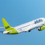 A picture of an airBaltic Airbus A220-300 aircraft on take-off