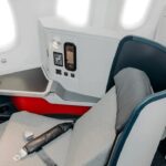 New cabin seats for Avianca Airlines INSIGNIA Business Class. They look modern with a white and grey design opposed with a splash of red that makes the cabin stand out.