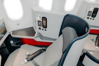 New cabin seats for Avianca Airlines INSIGNIA Business Class. They look modern with a white and grey design opposed with a splash of red that makes the cabin stand out.