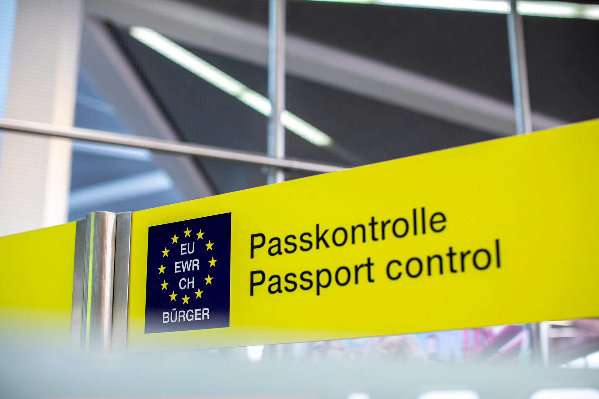 A sign for passport control in Europe with English translation
