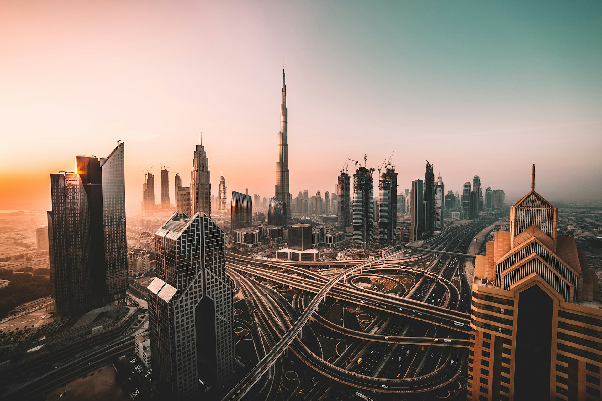 View of Dubai from above, showing city layout and high rise buildings.