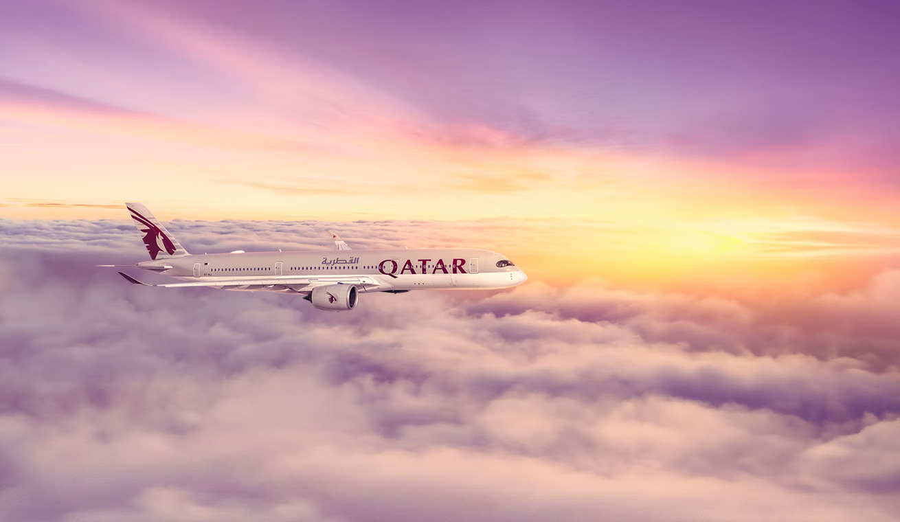 Photograph depicting Qatar Airways Airbus A350 cruising above the clouds.