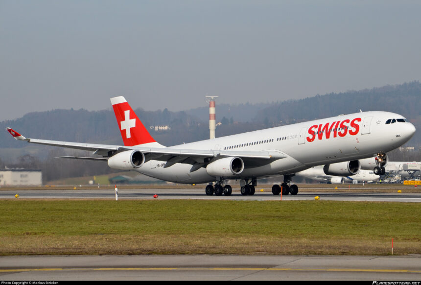Photograph depicting Swiss Airbus A340 taking off from the airport runway.
