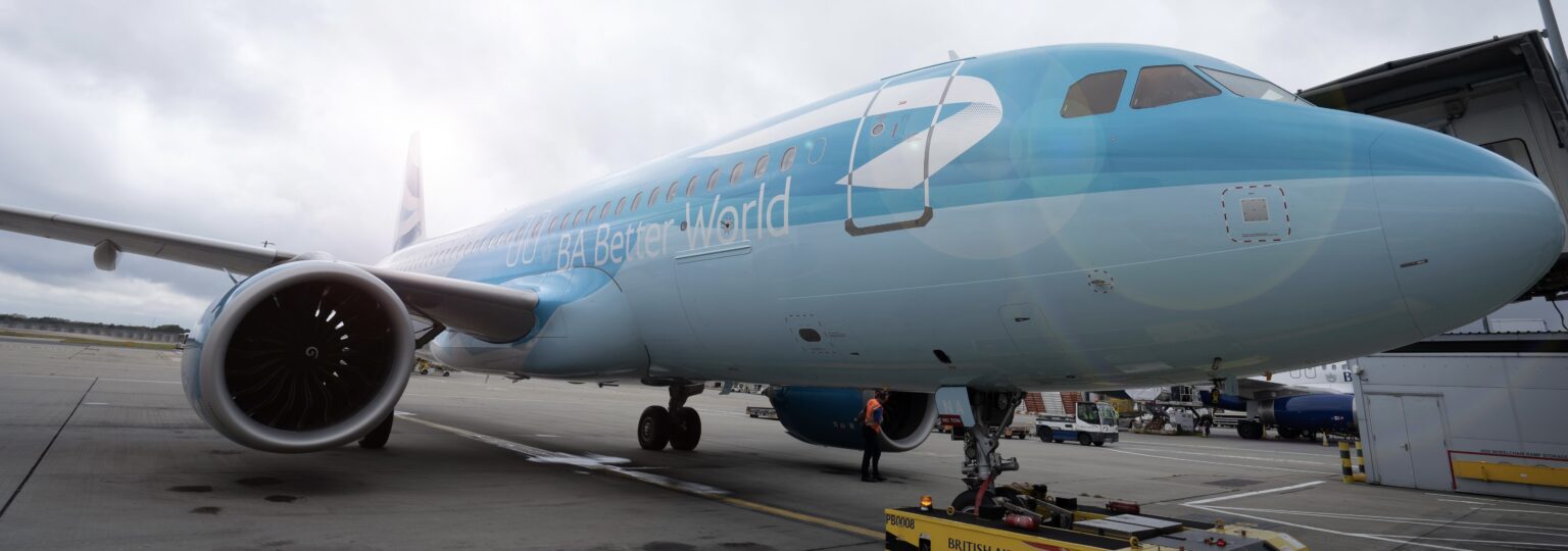 A light blue jet sat on a runway at London Heathrow Airport (LHR).