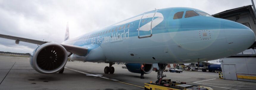 A light blue jet sat on a runway at London Heathrow Airport (LHR).