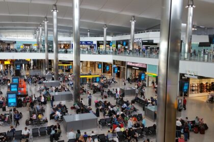 Lots of passengers inside of an airport in Heathrow (LHR).