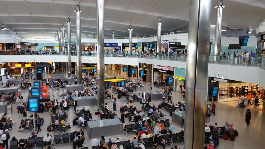 Lots of passengers inside of an airport in Heathrow (LHR).
