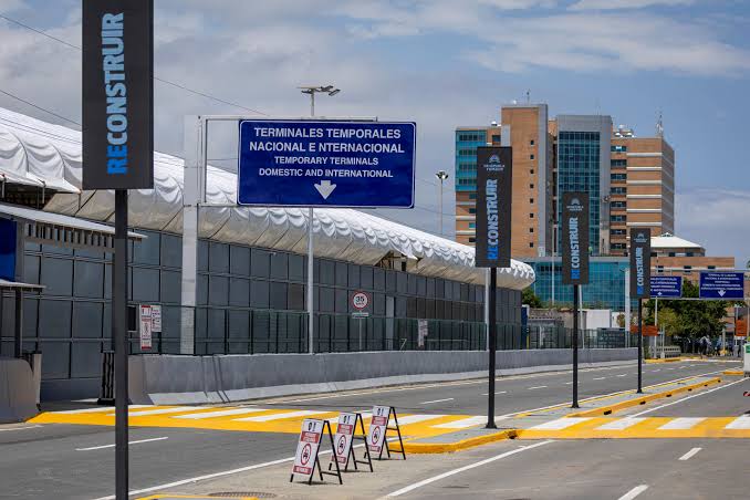 A large blue directional sign reading