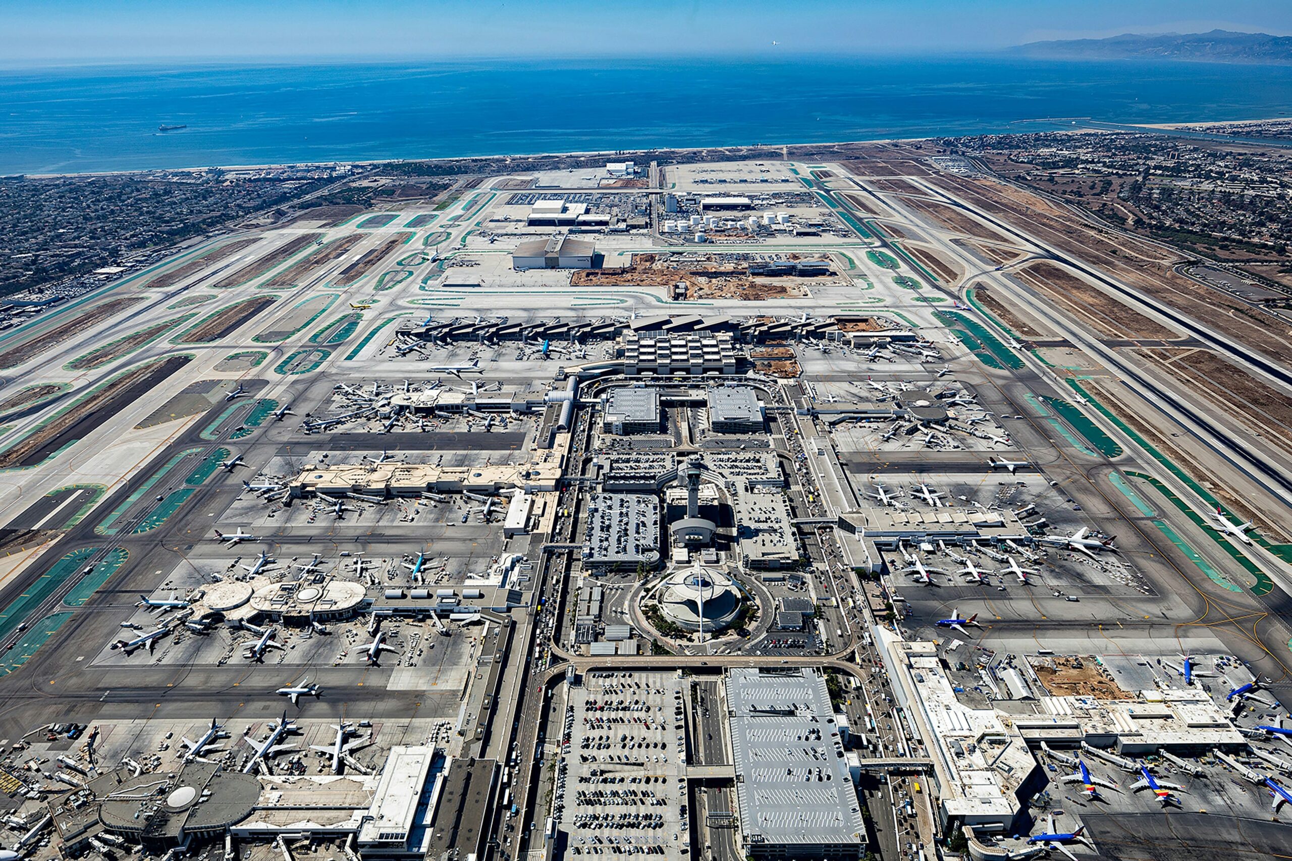 Aerial view of Los Angeles International Airport with the Pacific Ocean in the background