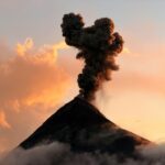Volcano emitting ash cloud during eruption