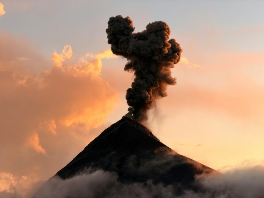 Volcano emitting ash cloud during eruption