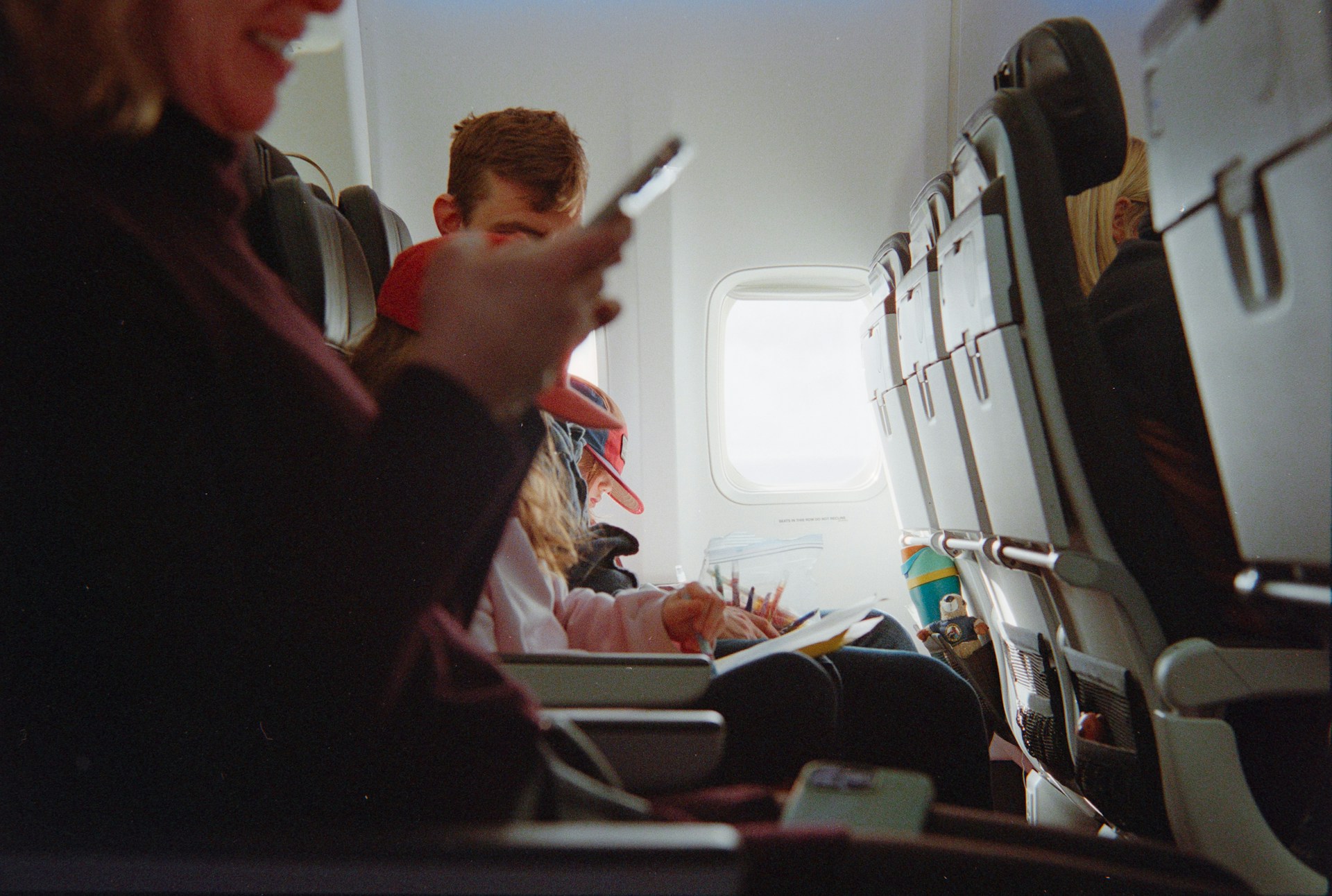 Passenger using phone in the plane 