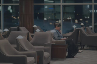 Photograph depicting a woman relaxing at a Star Alliance airport lounge.