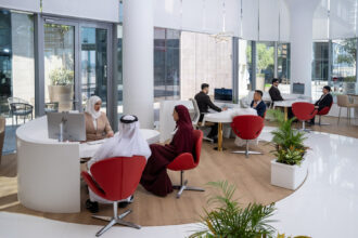 Photograph depicting the seating area and desks within Emirates new travel store in Bahrain.