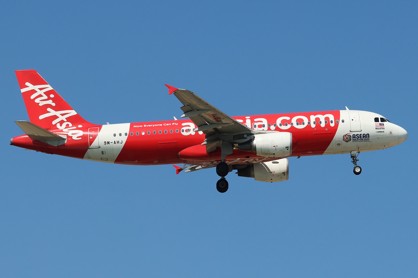 An AirAsia Airbus A320-216 taking off from Phu Quoc International Airport with its landing gear still extended.
