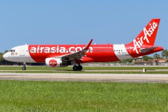 An AirAsia Airbus A320-216(WL) on the ground at Kota Kinabalu International Airport.