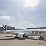 Photograph depicting the exterior of a refurbished Emirates Boeing-777 on the runway.