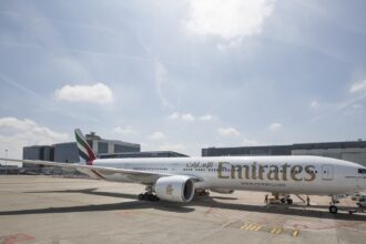Photograph depicting the exterior of a refurbished Emirates Boeing-777 on the runway.