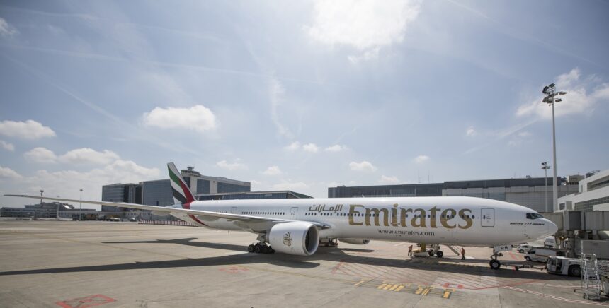 Photograph depicting the exterior of a refurbished Emirates Boeing-777 on the runway.