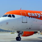 Photo of the side of an EasyJet plane facing SW