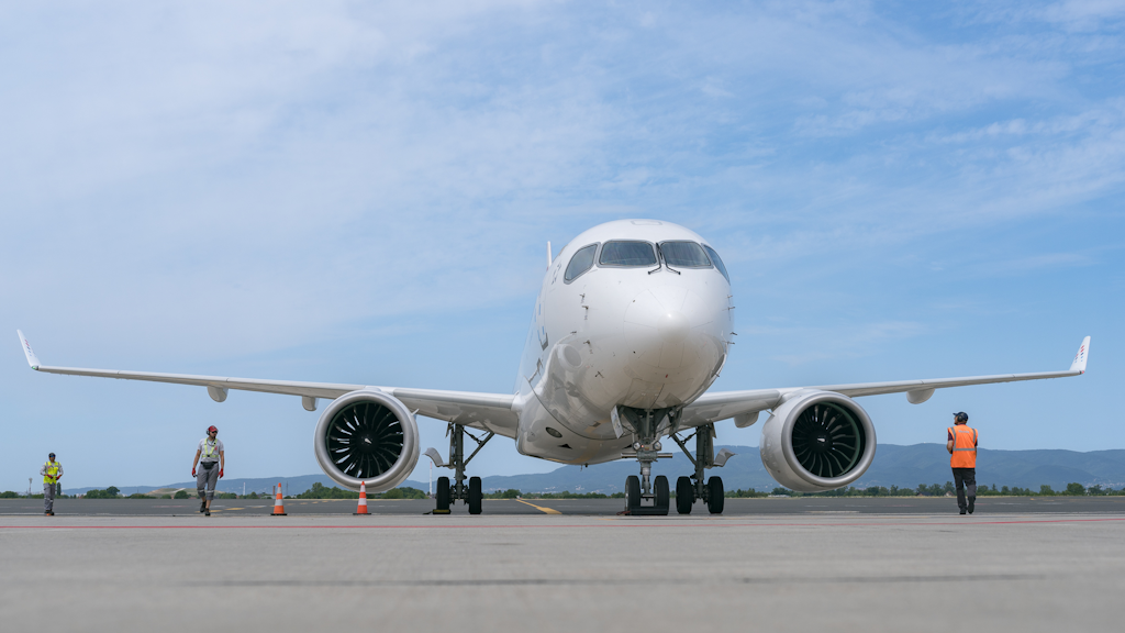 Photo of a plane on a terminal facing forwards