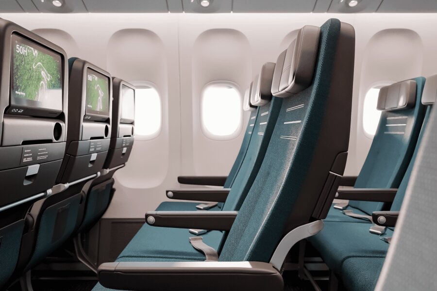 Photograph depicting Economy Class seats and overview of in-flight entertainment screens in Cathay Pacific's Economy Class cabin.
