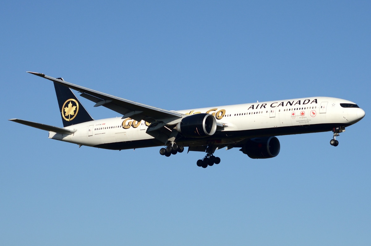 An Air Canada Boeing 777-333ER taking off from London Heathrow (LHR / EGLL) with its landing gear still extended.