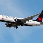 An Air Canada Boeing 737-8 MAX spotted mid-air with its landing gear extended.