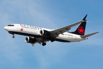 An Air Canada Boeing 737-8 MAX spotted mid-air with its landing gear extended.