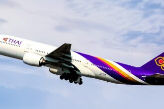 Picture depicting a Thai Airways Boeing 777 during flight