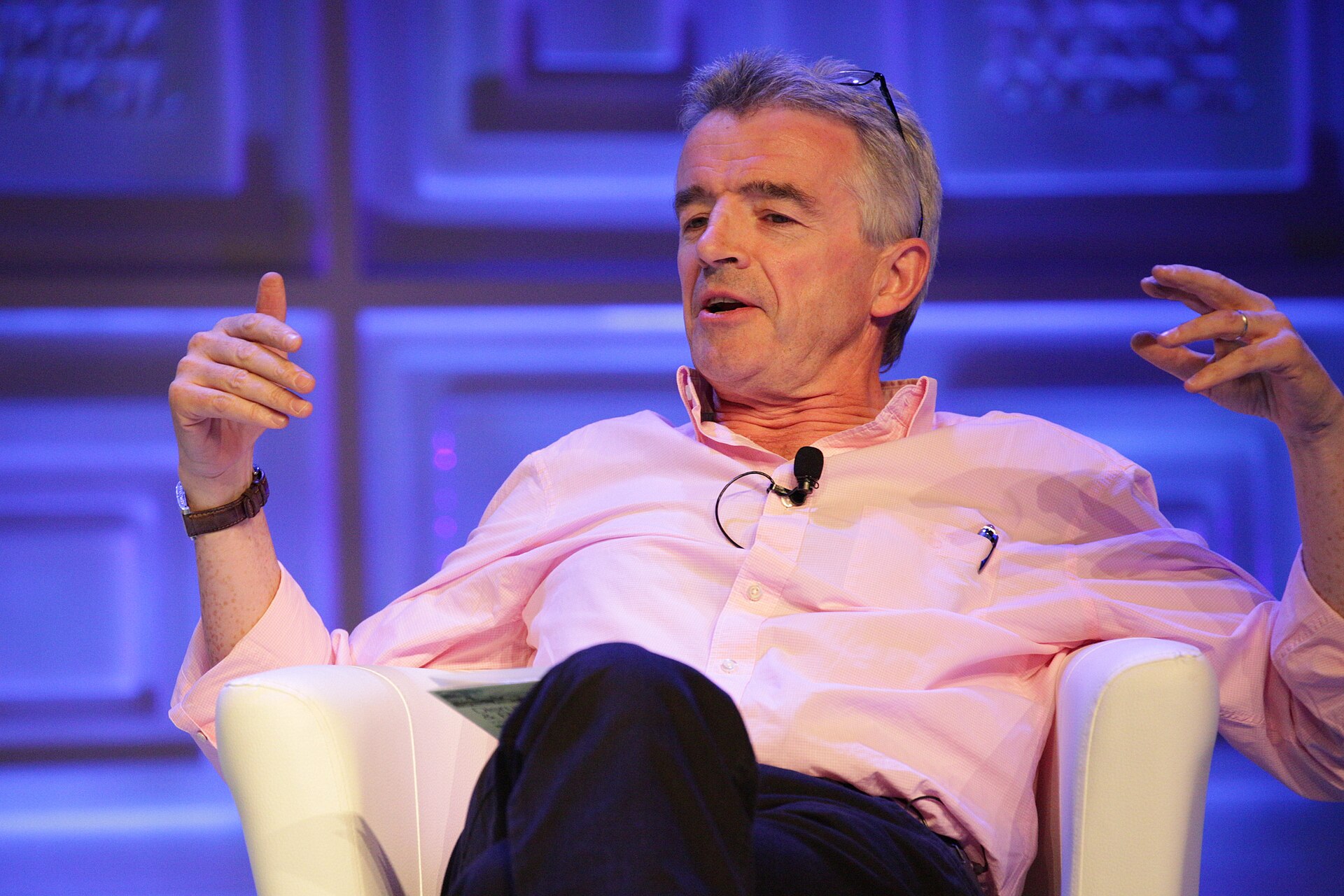 Michael O’Leary sat in an arm chair, wearing a pink shirt.