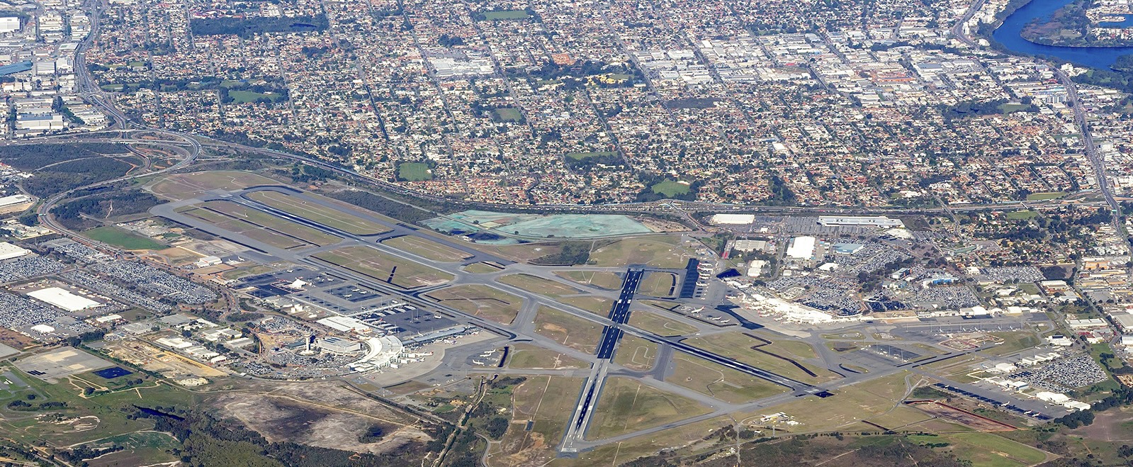 An aerial view of Perth Airport (PER) on a sunny day.