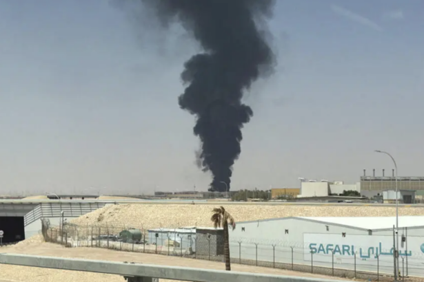 A large plume of black smoke rises from the fuel storage area at King Khalid International Airport in Riyadh, Saudi Arabia