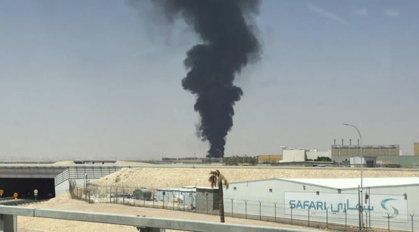 A large plume of black smoke rises from the fuel storage area at King Khalid International Airport in Riyadh, Saudi Arabia