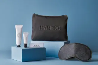 Singapore Airlines' new amenity kit for business class made in partnership with BYREDO, featuring a zip pouch with BYREDO's logo, three BYREDO products and an eye mask.