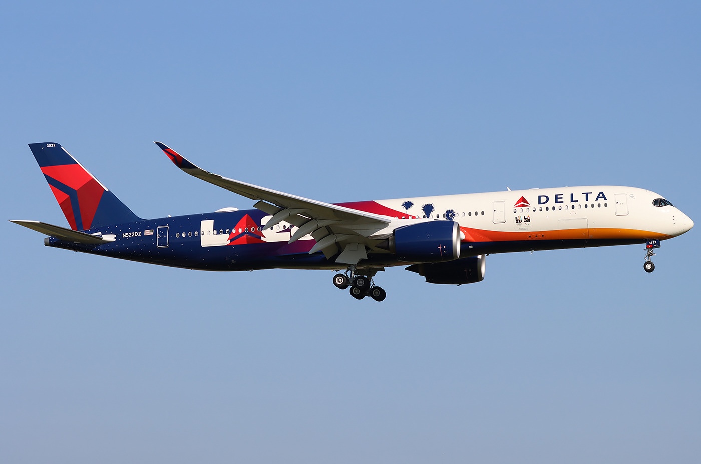 A Delta Air Lines Airbus A350-941 taking off from Amsterdam Schiphol (AMS / EHAM) with its landing gear still extended.