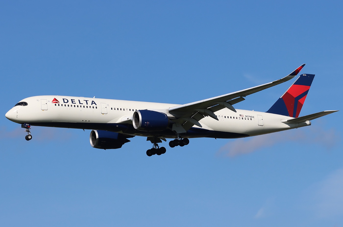 A Delta Air Lines Airbus A350-941 spotted at Amsterdam Schiphol Airport with its landing gear extended.