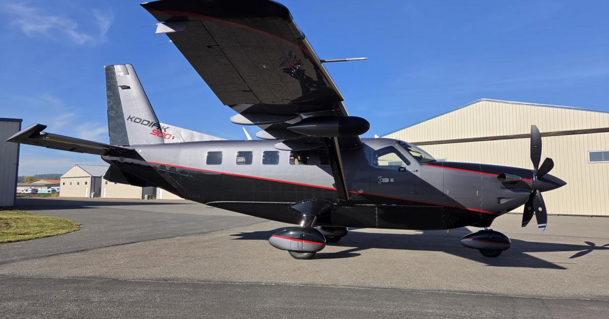 Photo of a Daher aircraft facing Eastwards in front of an airport