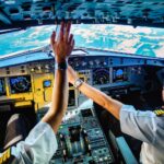 Image shows two pilots in a cockpit