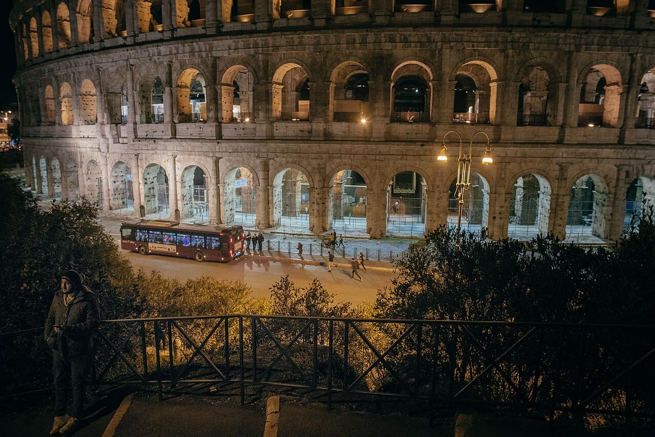 The Colosseum illuminated at night in Rome