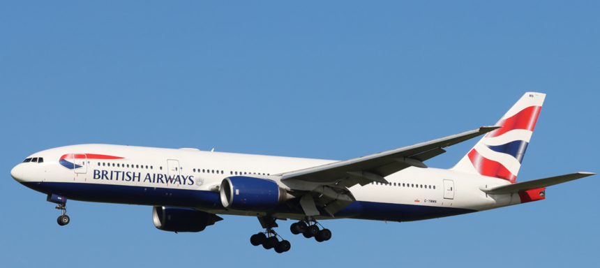 Image shows a British Airways Boeing 777 from the side. The livery is red, white and blue in the style of the UK flag.