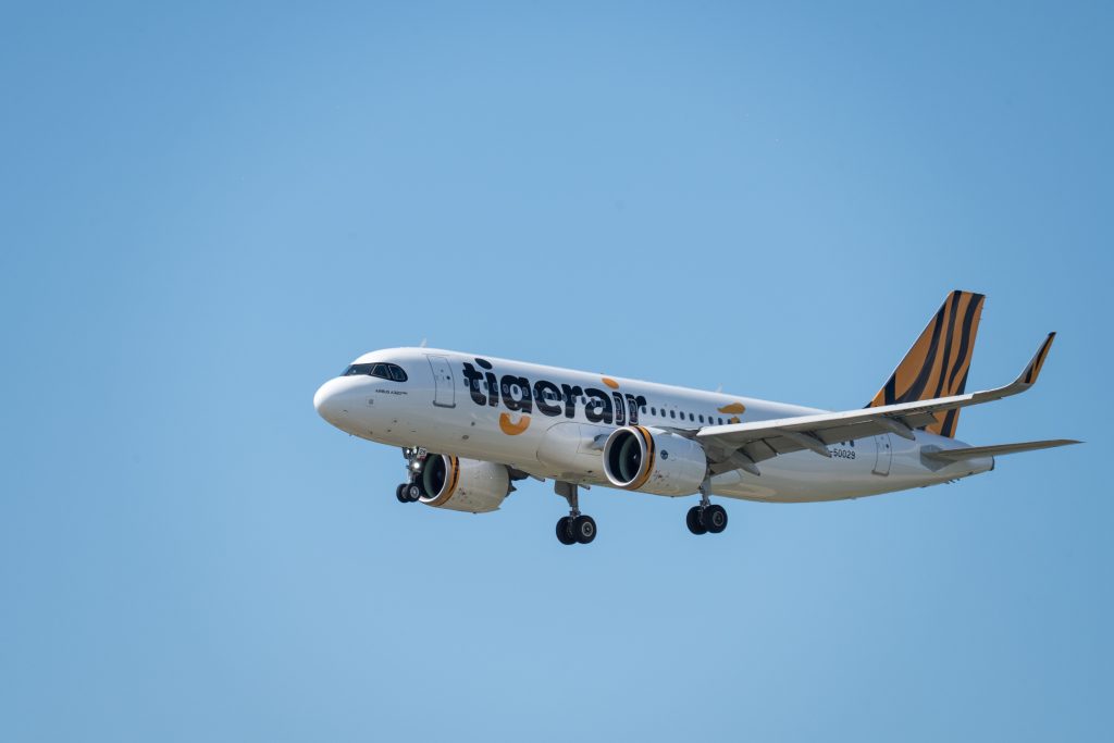 An image of a Tigerair aircraft flying against a blue sky in Taiwan.