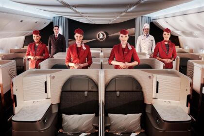 Turkish Airlines flight attendants standing in the new Crystal suite in the business class cabin.