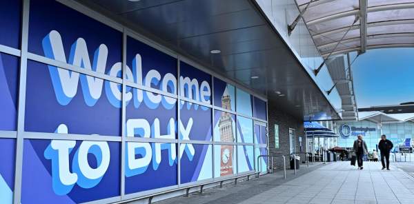 Signage at Birmingham Airport saying "Welcome to BHX"
