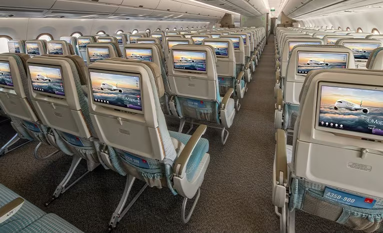 Photograph depicting Economy Class seats onboard the Emirates A350 with in-flight entertainment screens.